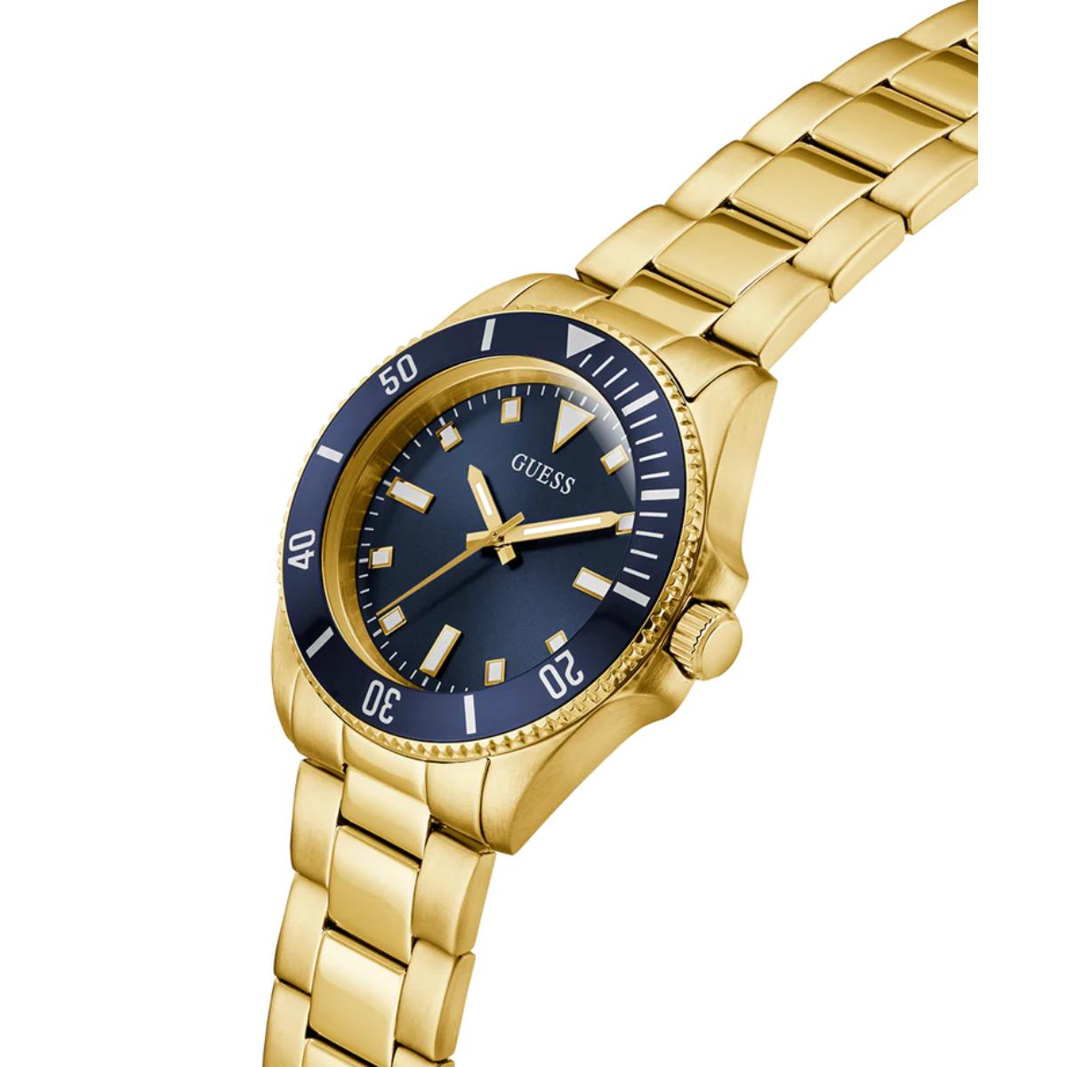 Gold watch with a blue face on a white background