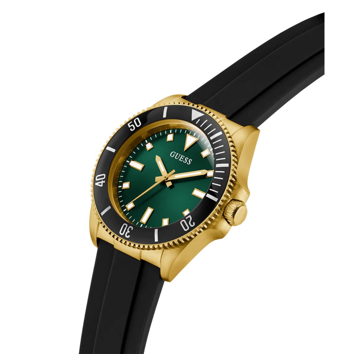 Watch with green dial, gold case, and black strap on a white background
