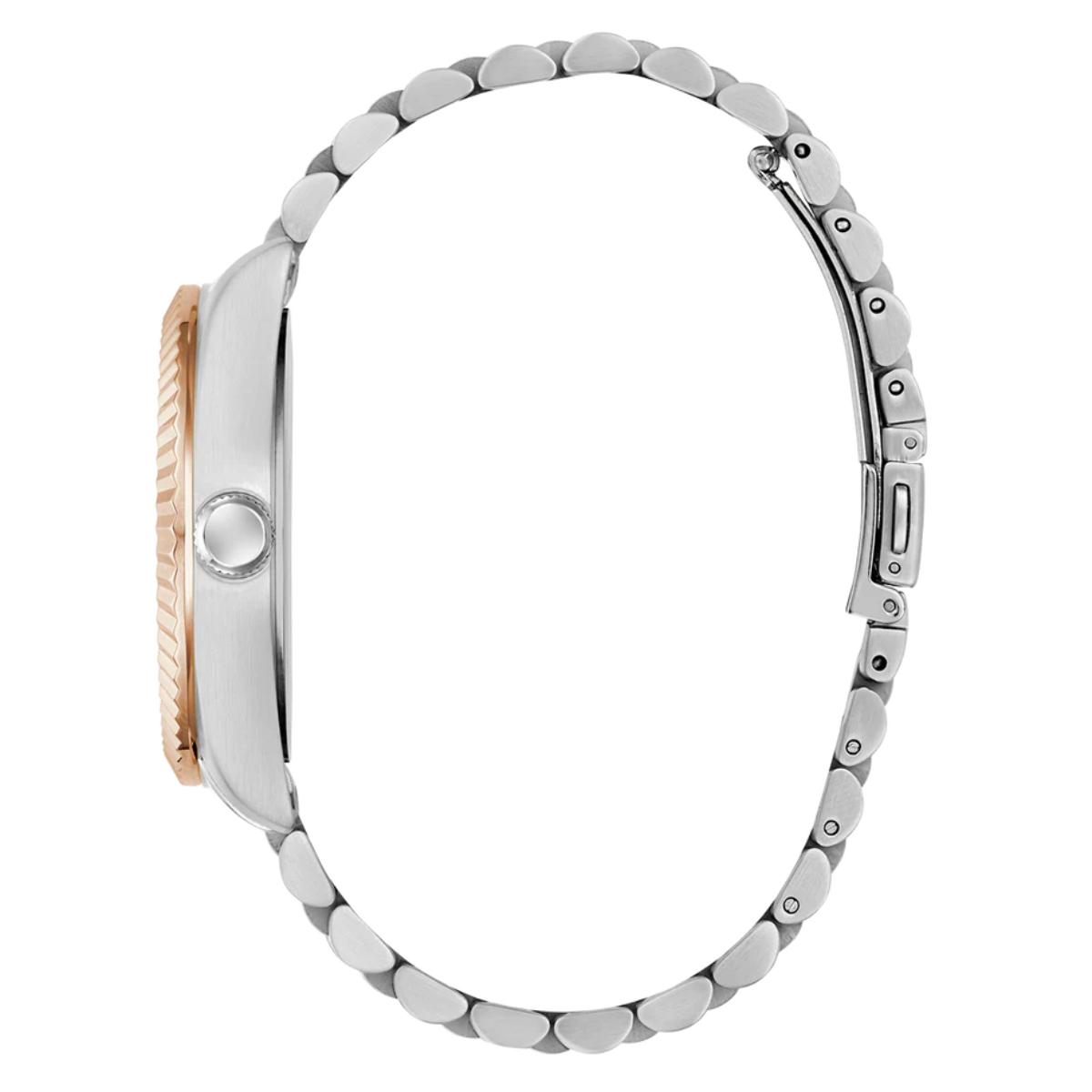 Close-up of a silver watch with rose gold accents on a white background