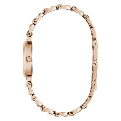 Rose gold bracelet on a light beige background