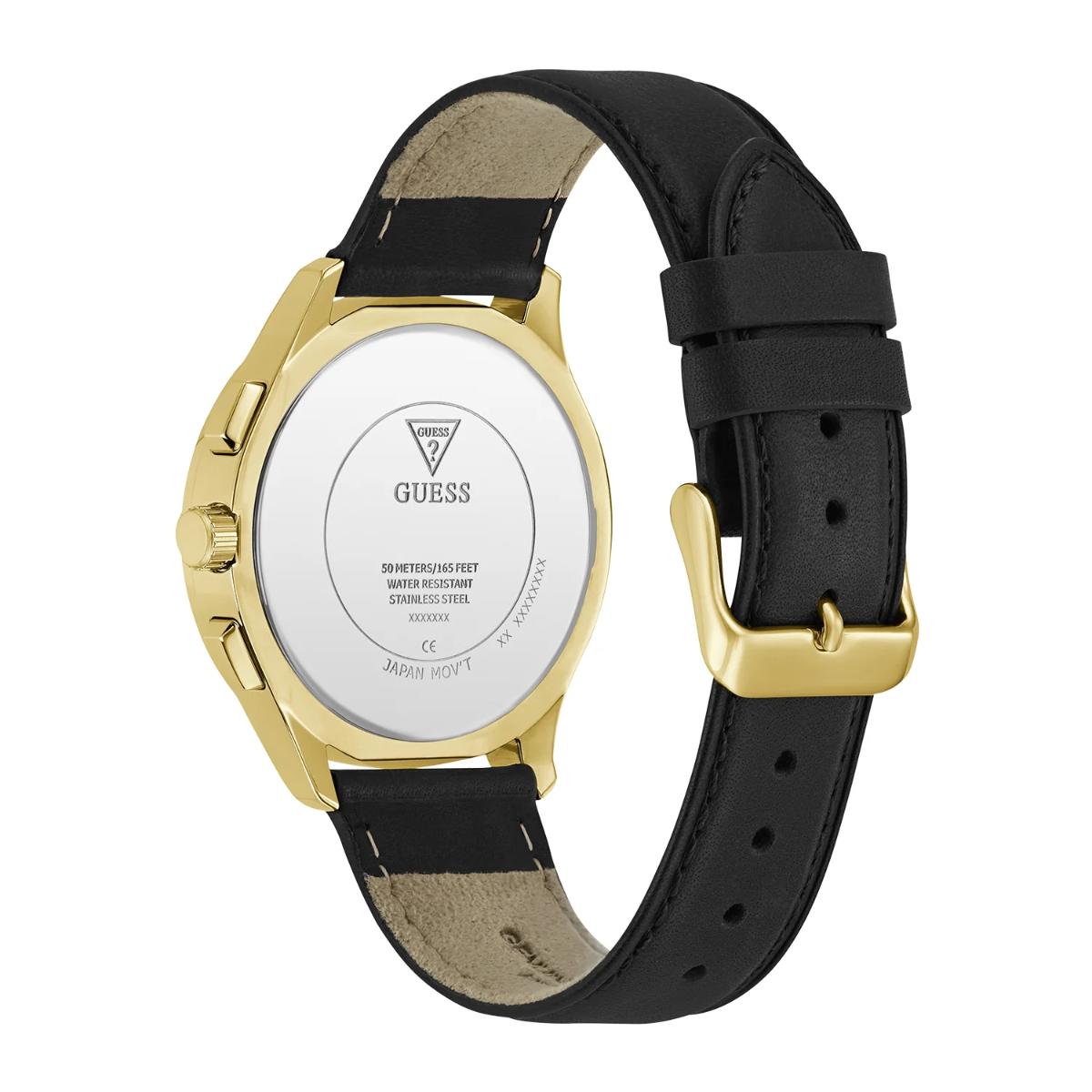 Guess watch with black strap and gold case on a white background