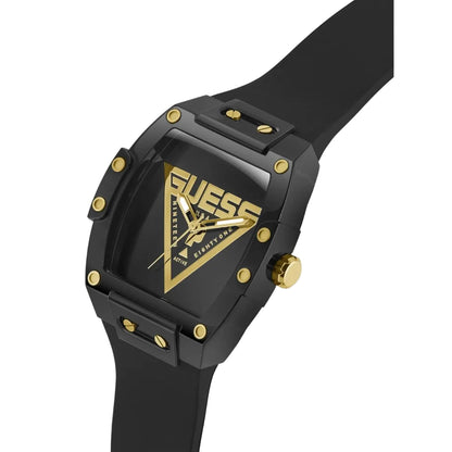 Black and gold Guess watch on a light gray background