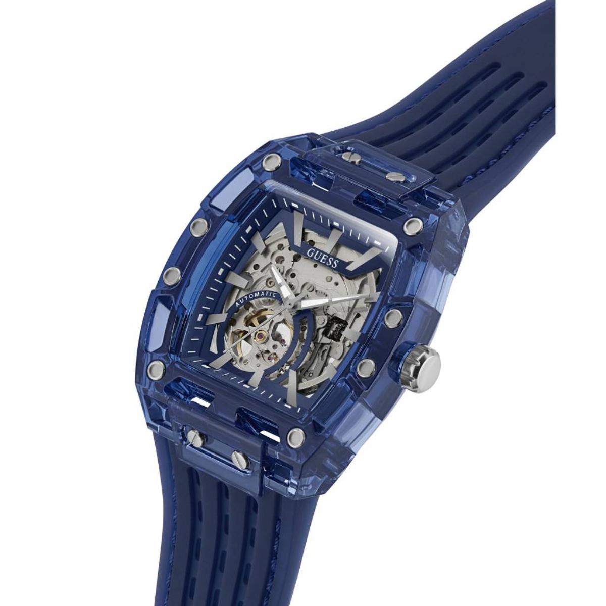 Blue Guess watch with transparent case on a white background
