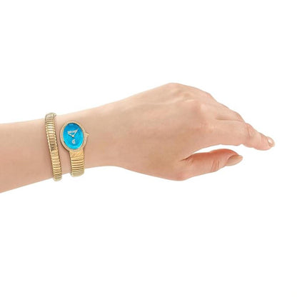 Hand wearing a gold watch with a blue face on a white background
