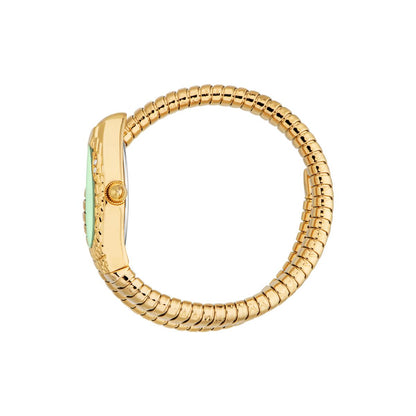 Gold ring with a green gemstone on a white background