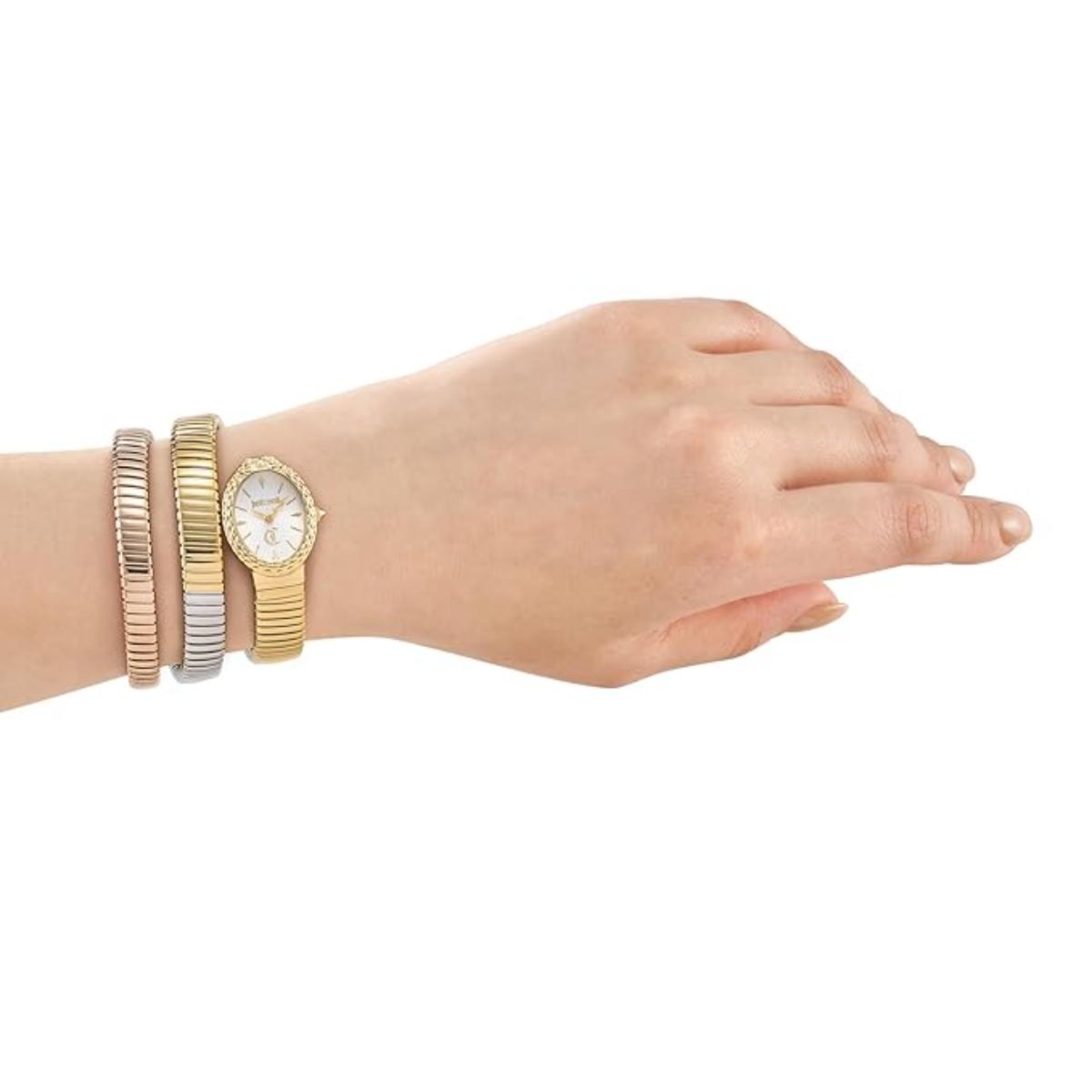 Hand wearing a gold watch with multiple bracelets on a white background