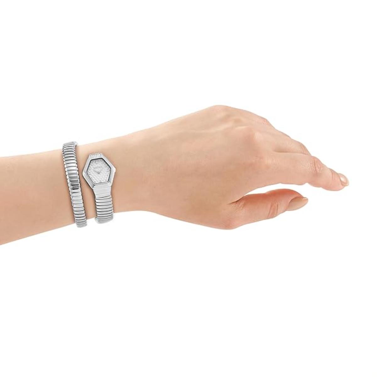 Hand wearing a silver bracelet and watch on a white background
