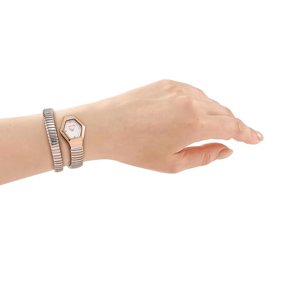 Hand wearing a rose gold watch and bracelet on a white background