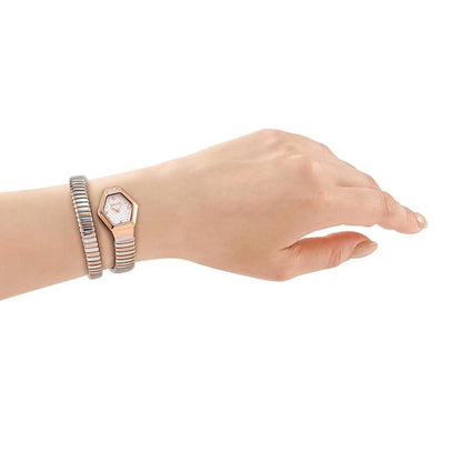 Hand wearing a rose gold watch and bracelet on a white background