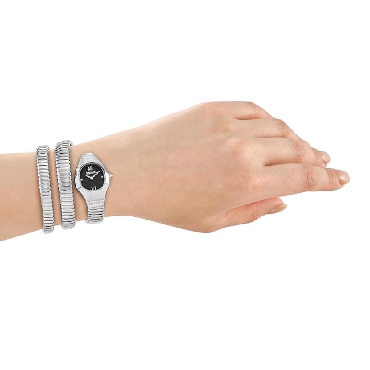 Hand wearing a silver watch and bracelets on a white background
