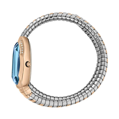 Two-toned ring with blue gemstone on a white background