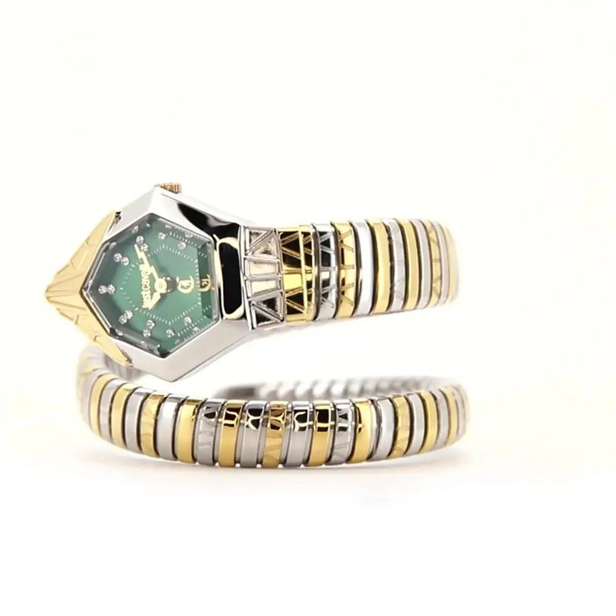 Gold and silver ring with green gemstone on a white background