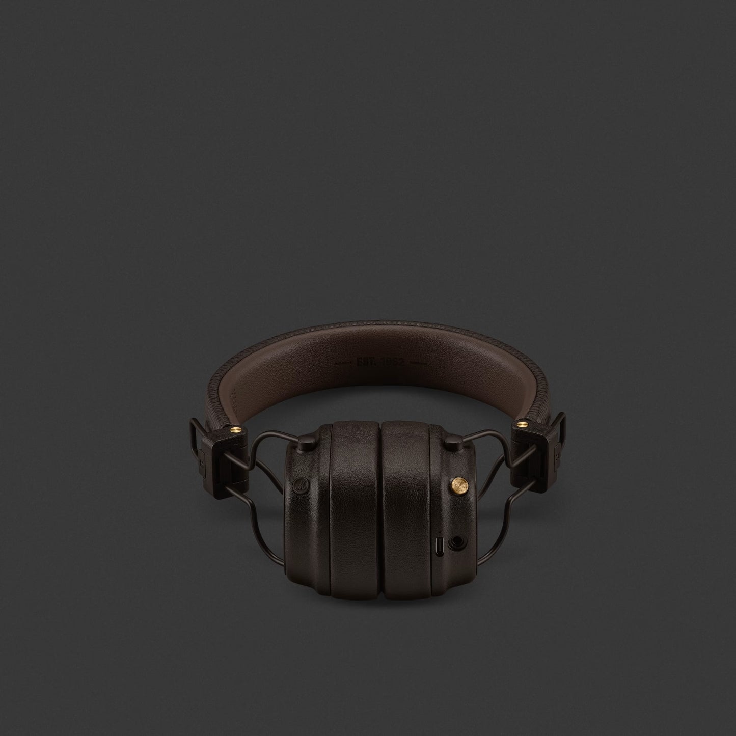Brown headphones on a dark gray background