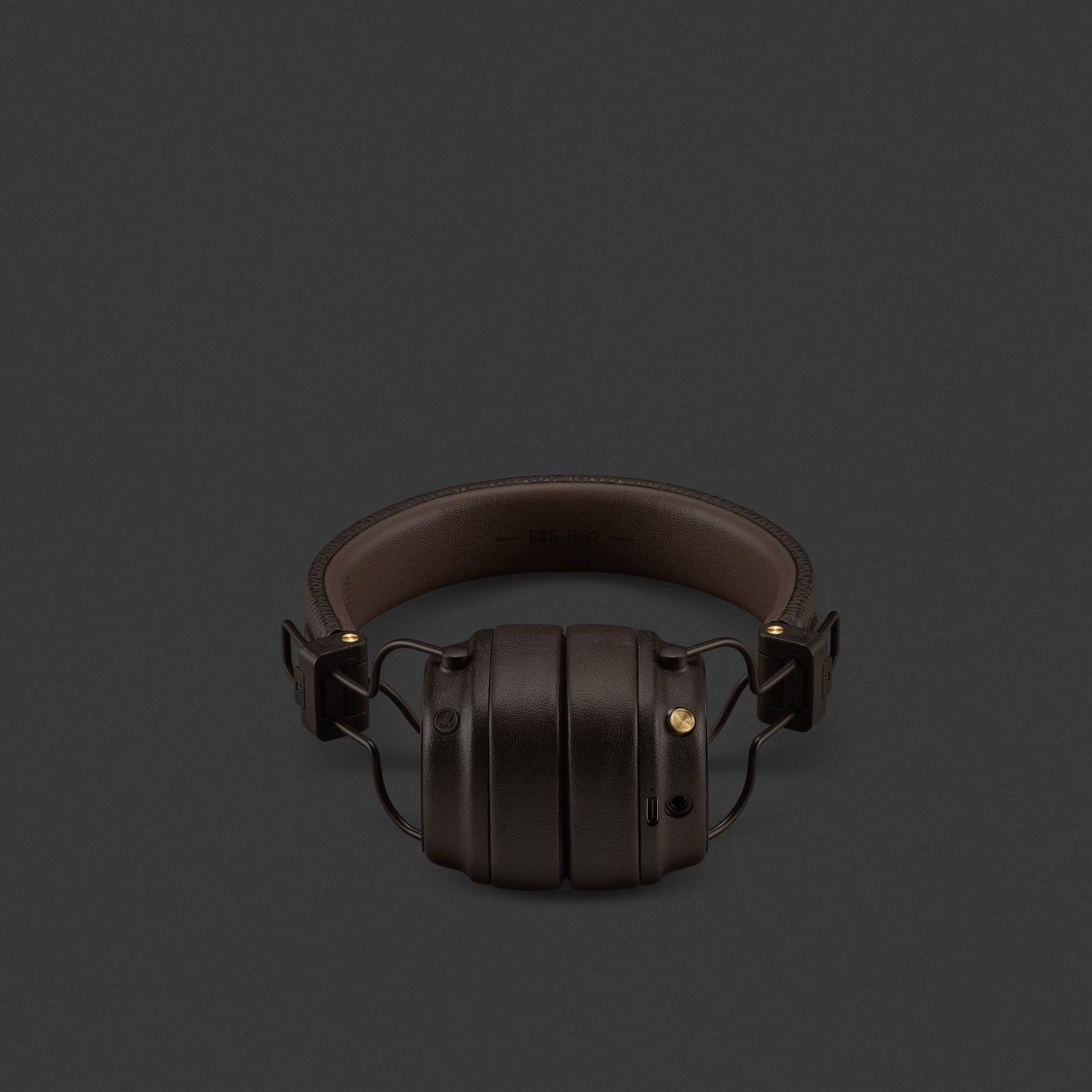 Brown headphones on a dark gray background
