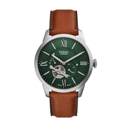 Fossil watch with green dial and brown leather strap on a white background