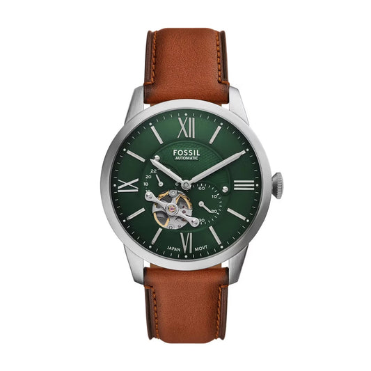 Fossil watch with green dial and brown leather strap on a white background