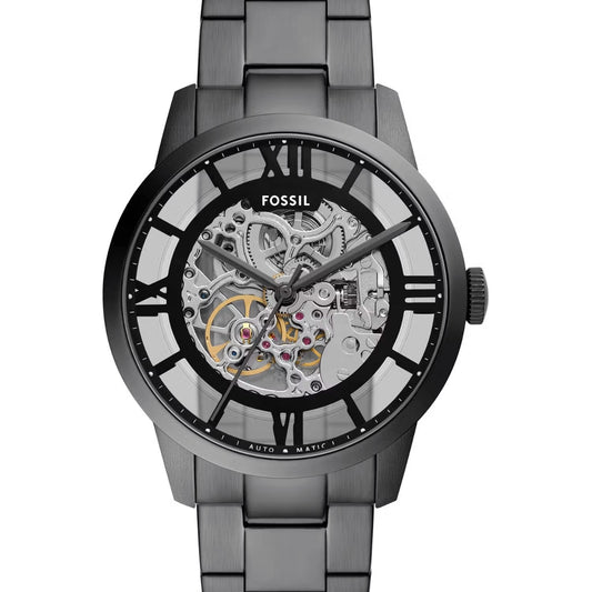 Fossil watch with metallic band and transparent face on a white background