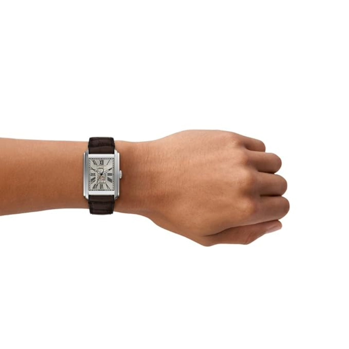 Hand wearing a silver watch with a brown leather strap on a white background
