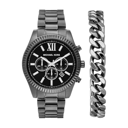Michael Kors watch with black face and silver band, next to a silver chain bracelet on a white background.