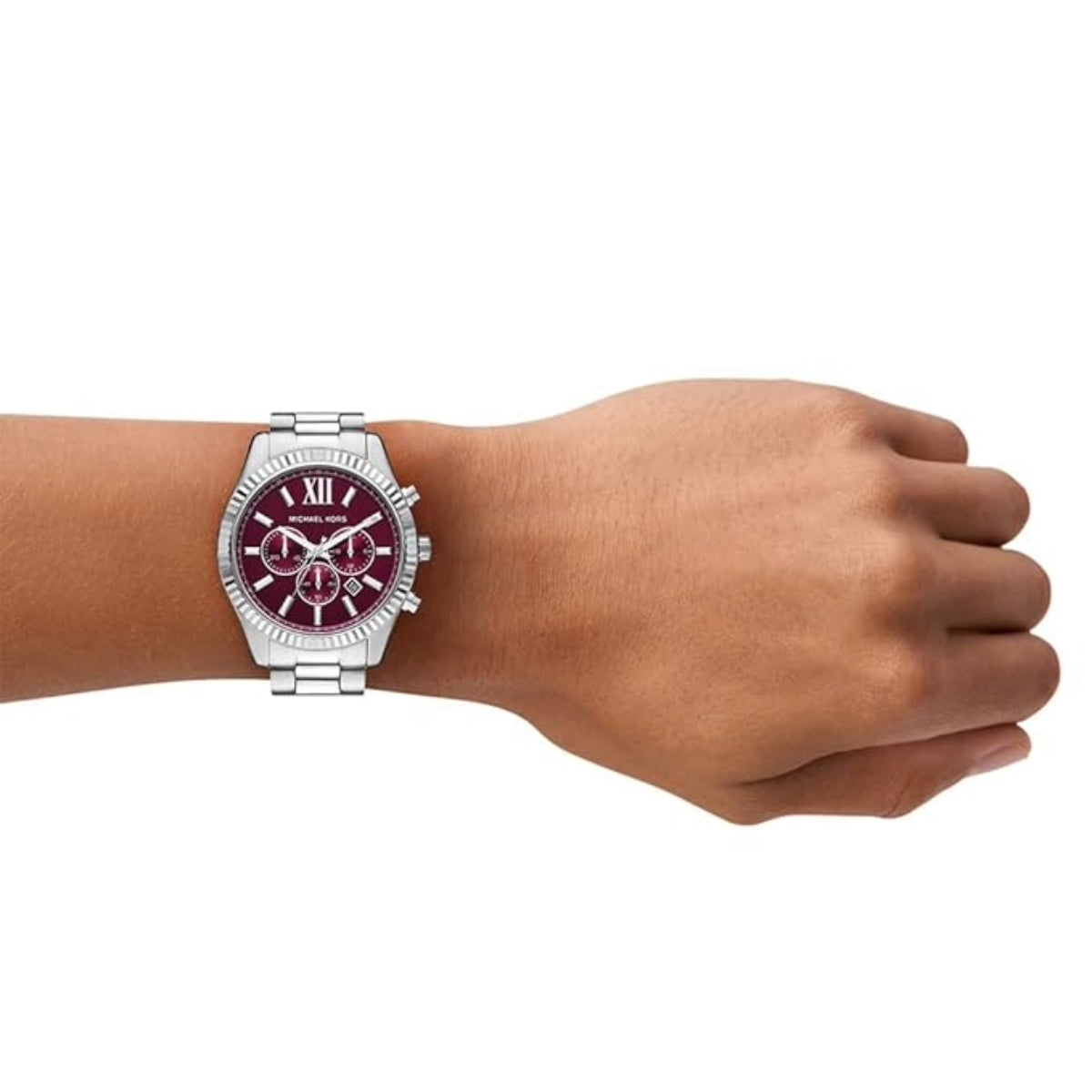 Hand wearing a watch with a maroon face on a white background