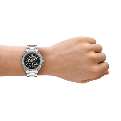 Silver watch on a wrist against a white background