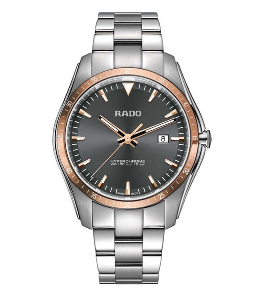 A RADO HyperChrome men's watch with a silver bracelet and rose gold case, featuring a black dial with watch hands and a date display.