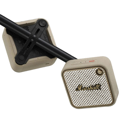 Marshall speaker with beige finish and black accents on a dark background