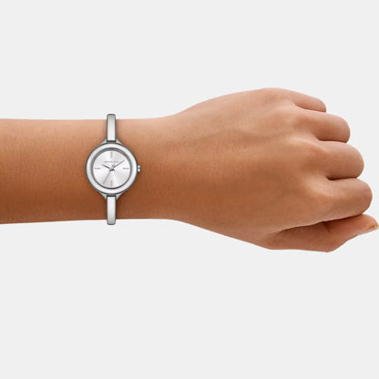 Silver watch on a wrist against a white background
