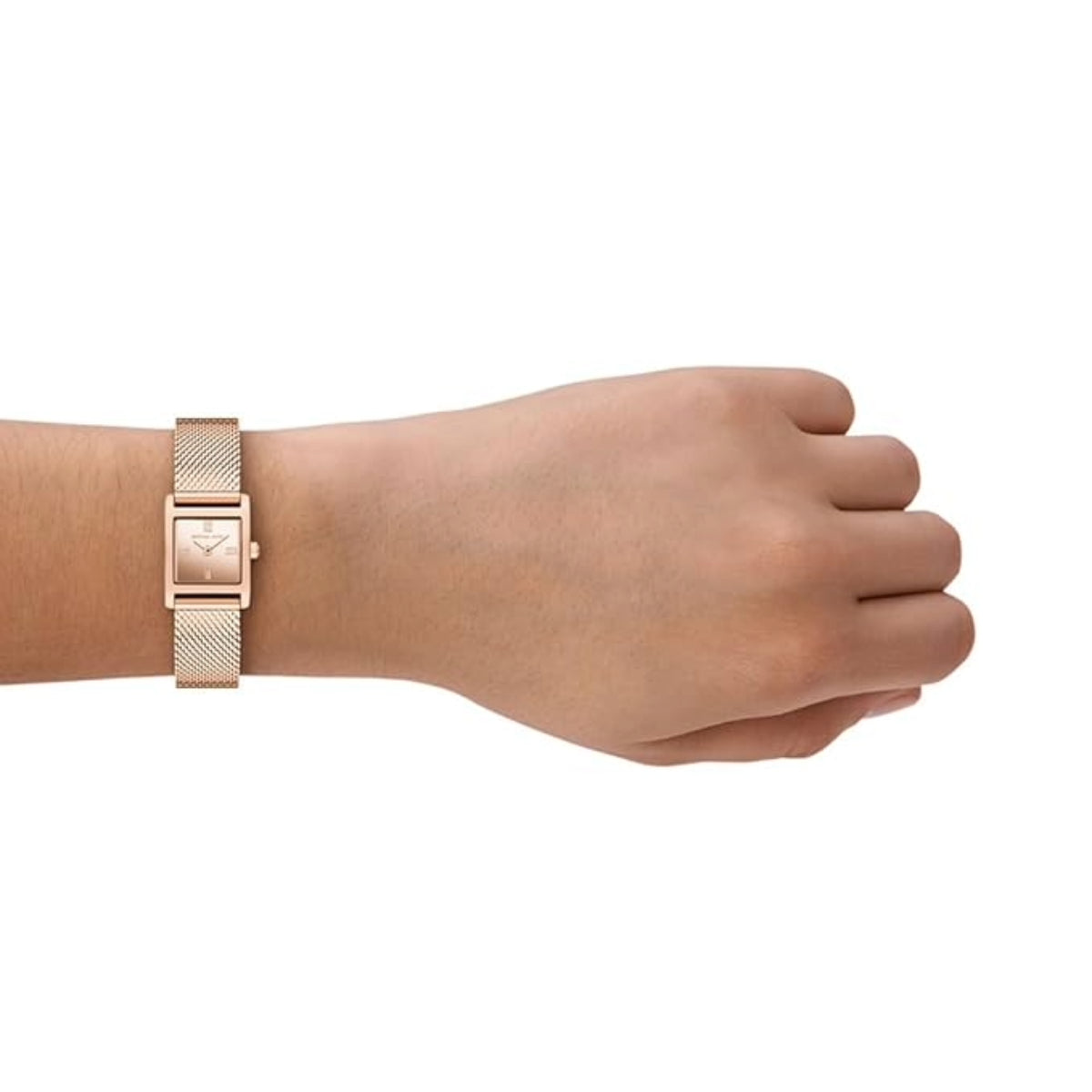 Rose gold bracelet on a wrist against a white background