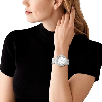 Woman wearing a silver watch on a white background