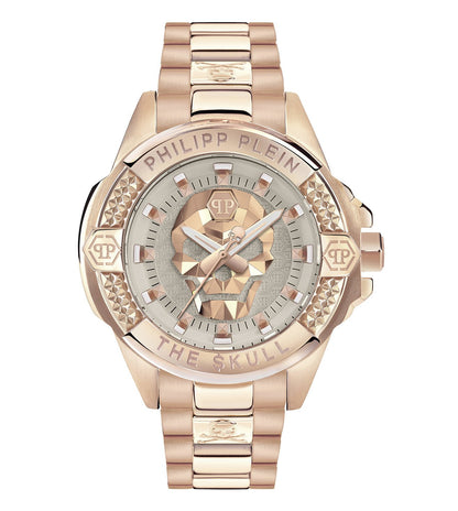A beige analog women's watch with a skull design on the dial and a gold-tone finish on the stainless steel case. The watch has a bracelet style and a silver-tone buckle.