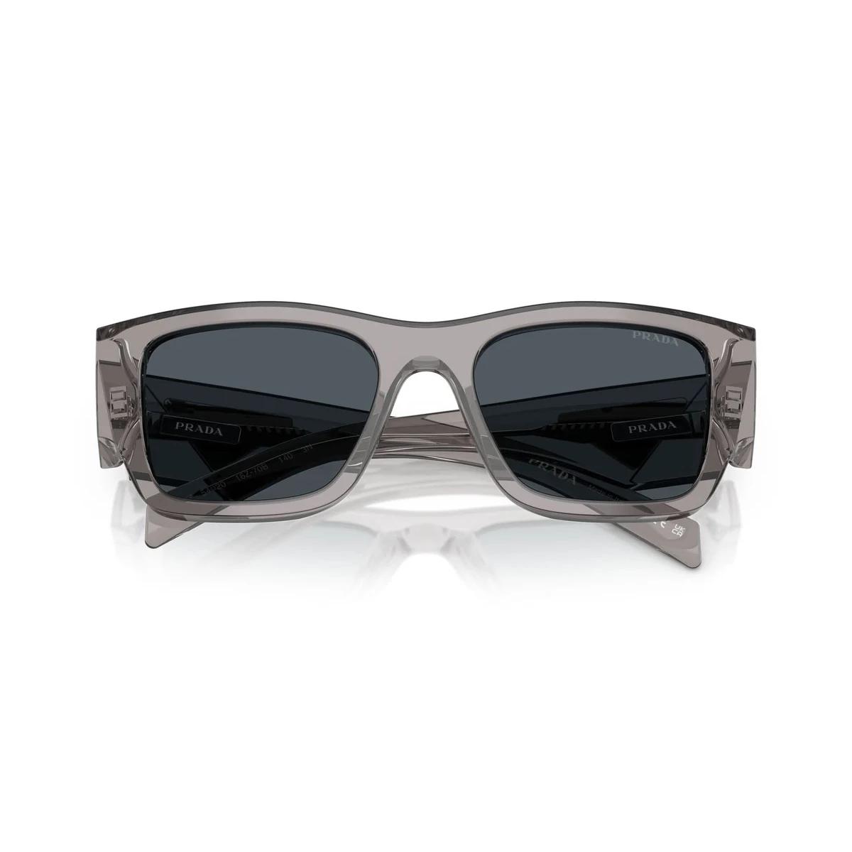 Gray sunglasses with dark lenses on a white background