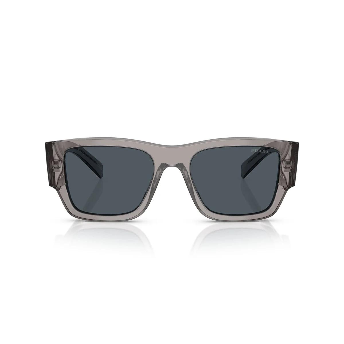 Sunglasses with a transparent frame and dark lenses on a white background