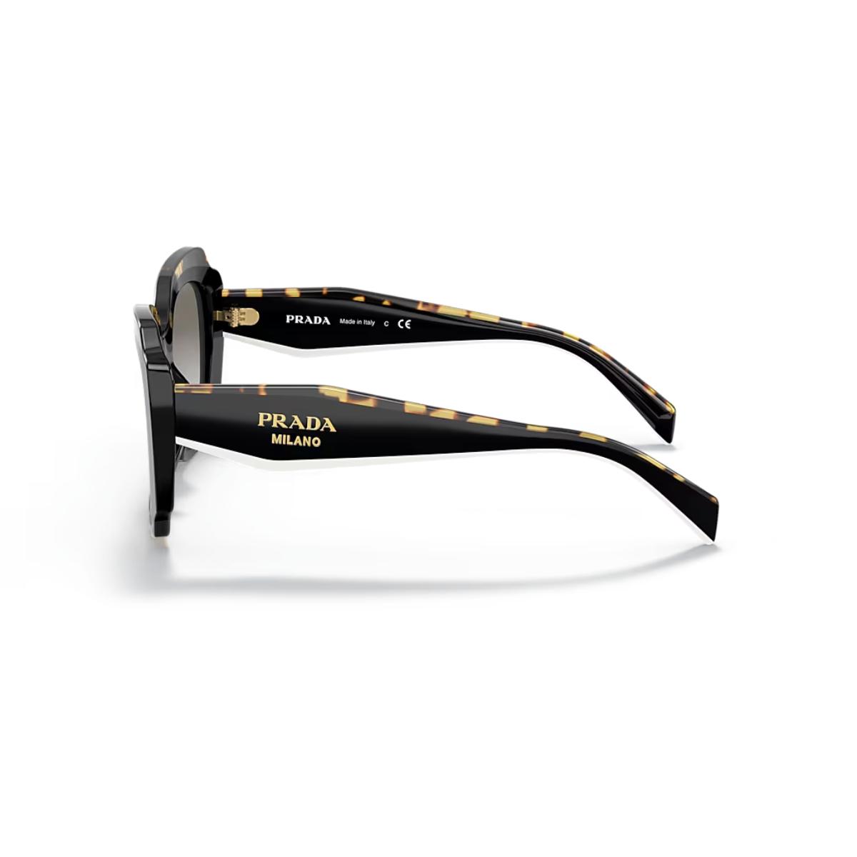 Prada sunglasses with black and gold frame on a white background