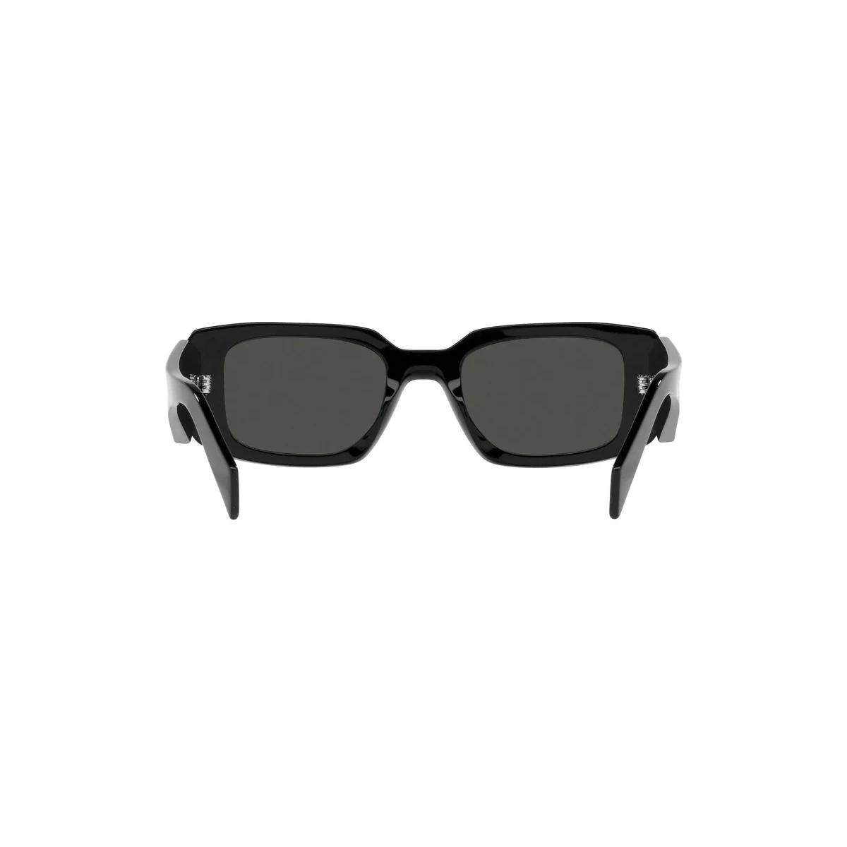 Black sunglasses with dark lenses on a white background