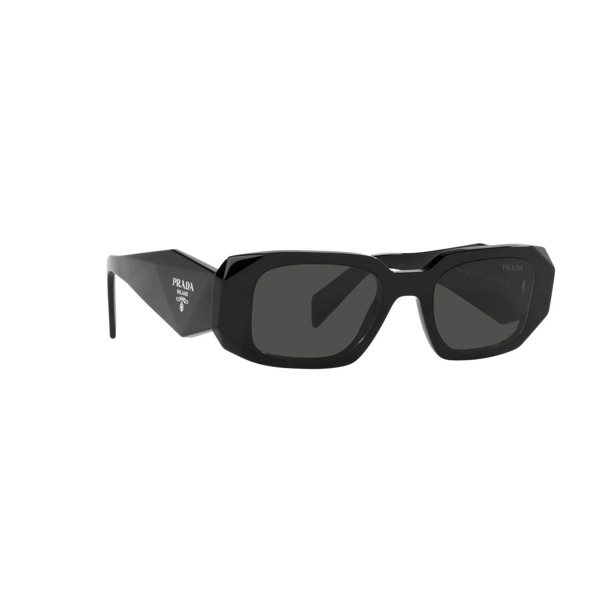 Black sunglasses with Prada logo on a white background