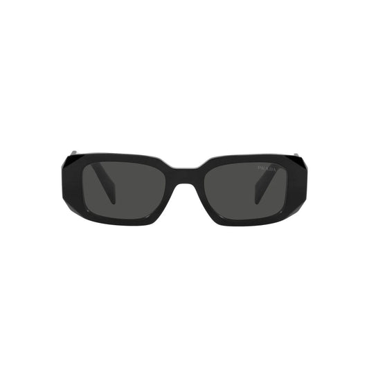 Black sunglasses with dark lenses on a white background