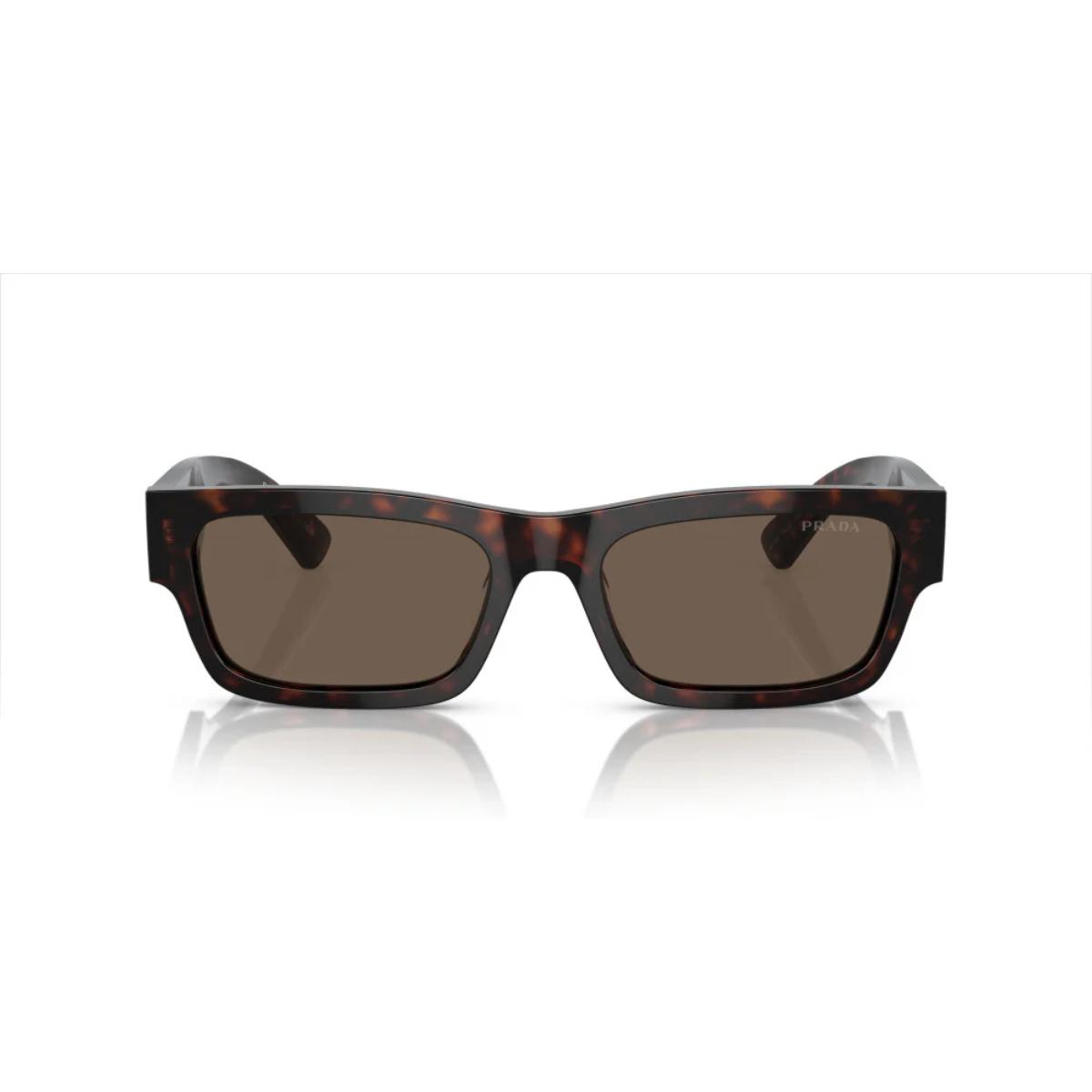 Sunglasses with tortoiseshell frame and dark lenses on a white background