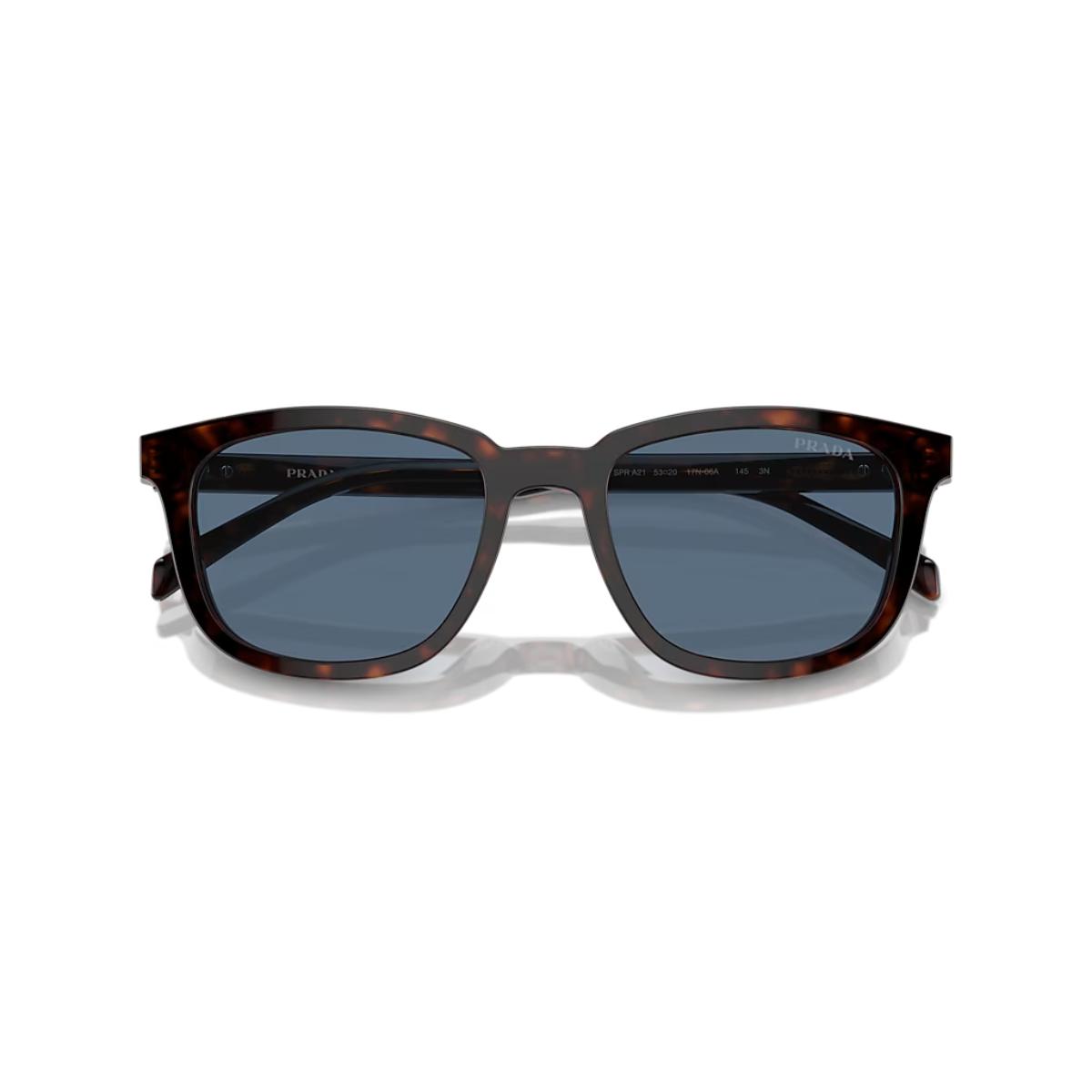 Sunglasses with tortoiseshell frame and dark lenses on a white background