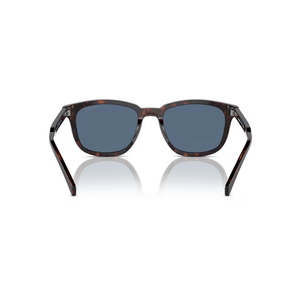 Sunglasses with tortoiseshell frame and dark lenses on a white background