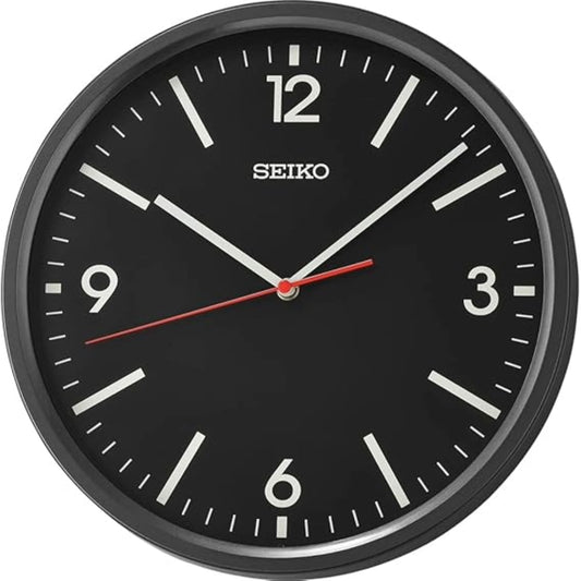 Seiko wall clock with black face and black frame on a white background