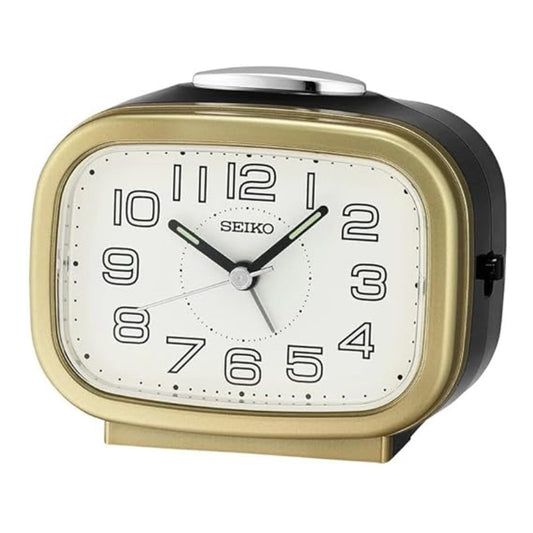 Seiko alarm clock with gold and black design on a white background