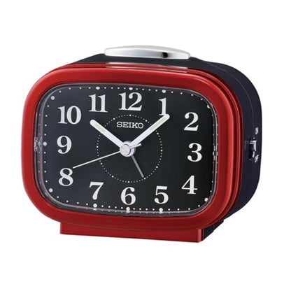 Red and black Seiko alarm clock on a white background