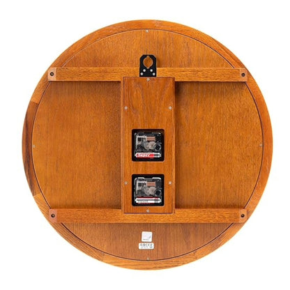 Wooden reel with two tapes inside on a white background