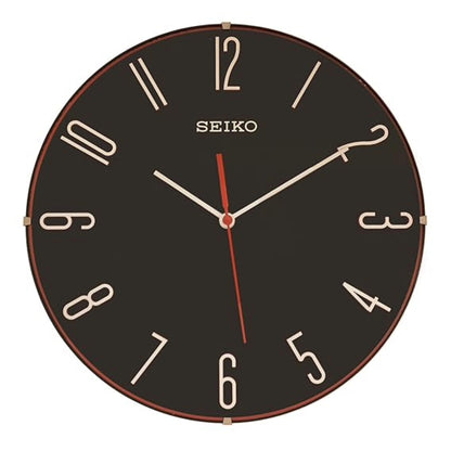 Seiko wall clock with black face and gold trim on a white background