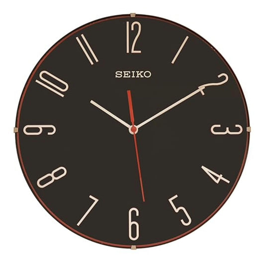 Seiko wall clock with black face and gold trim on a white background