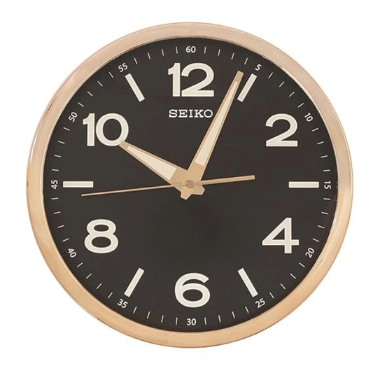 Seiko wall clock with black face and gold casing on a white background