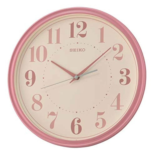 Pink Seiko wall clock on a white background
