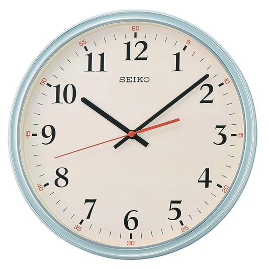 Seiko wall clock with a white face and blue rim on a white background