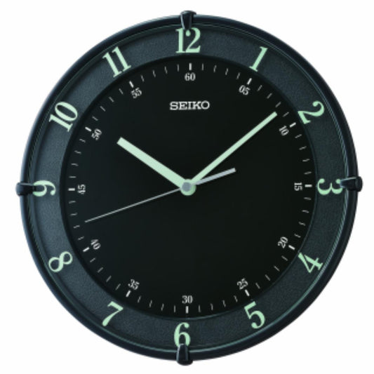Seiko wall clock with black face and green numbers on a white background